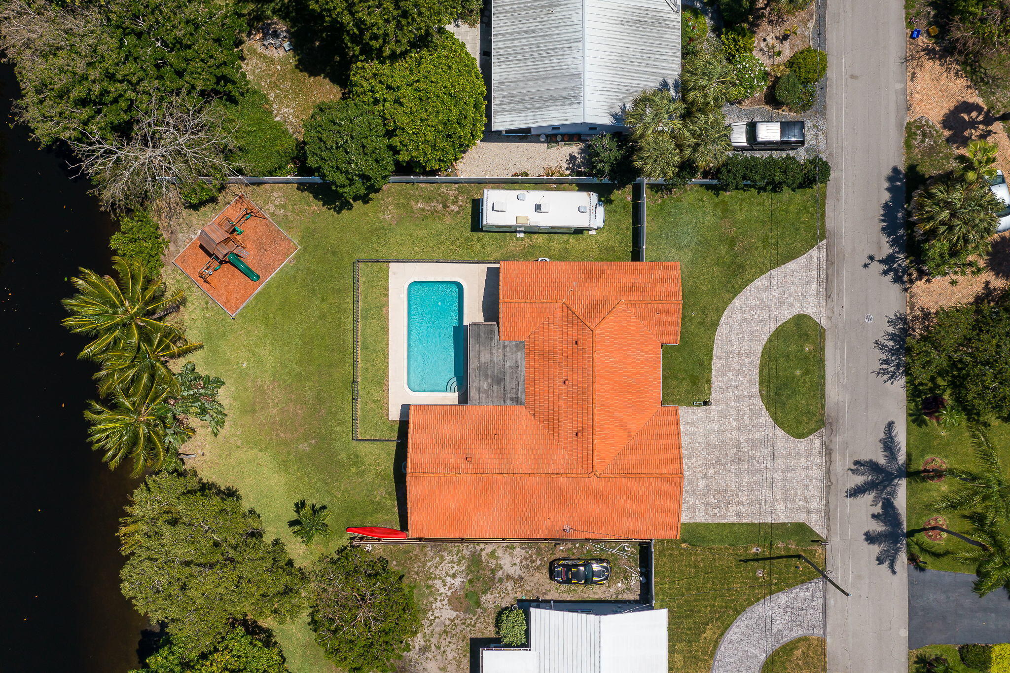 1151 Northwest 6th Avenue Boca Raton, FL 33432 - Photo 31 of 42 an aerial view of a house with swimming pool a yard and outdoor seating