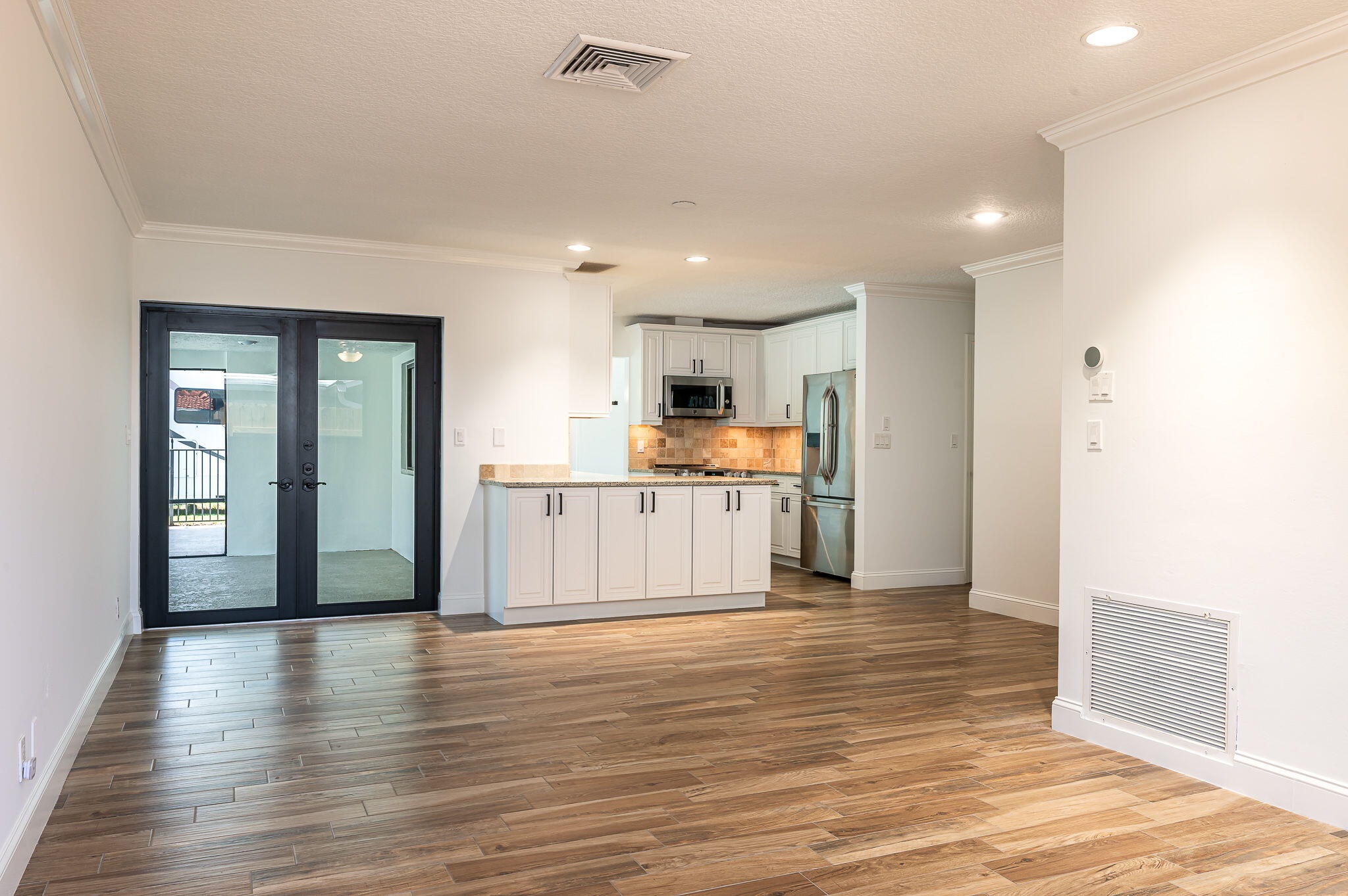 1151 Northwest 6th Avenue Boca Raton, FL 33432 - Photo 10 of 42 a view of a kitchen with wooden floor