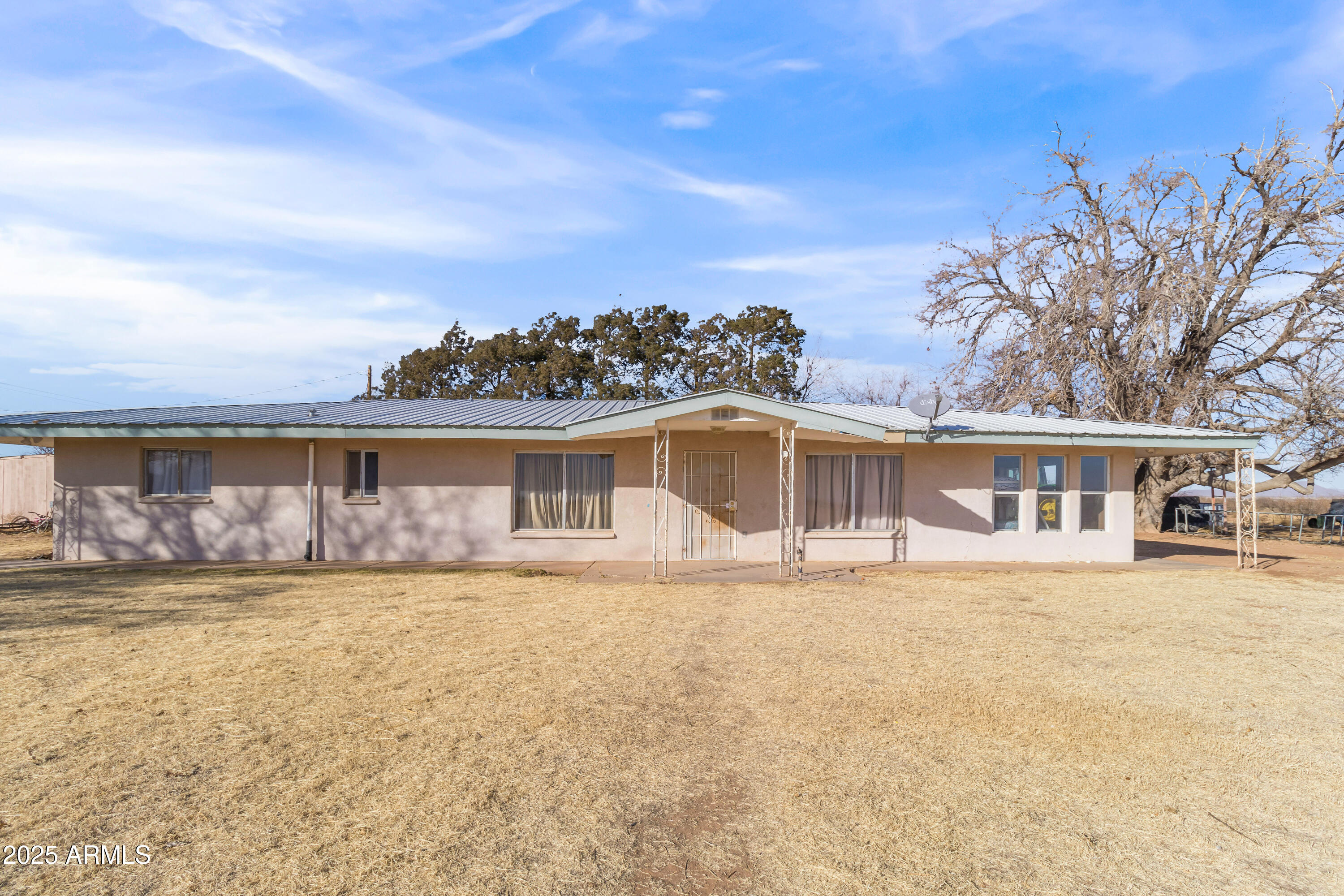 4842 West Gleeson Road Elfrida, AZ 85610 - Photo 12 of 51 a front view of a house with a garden