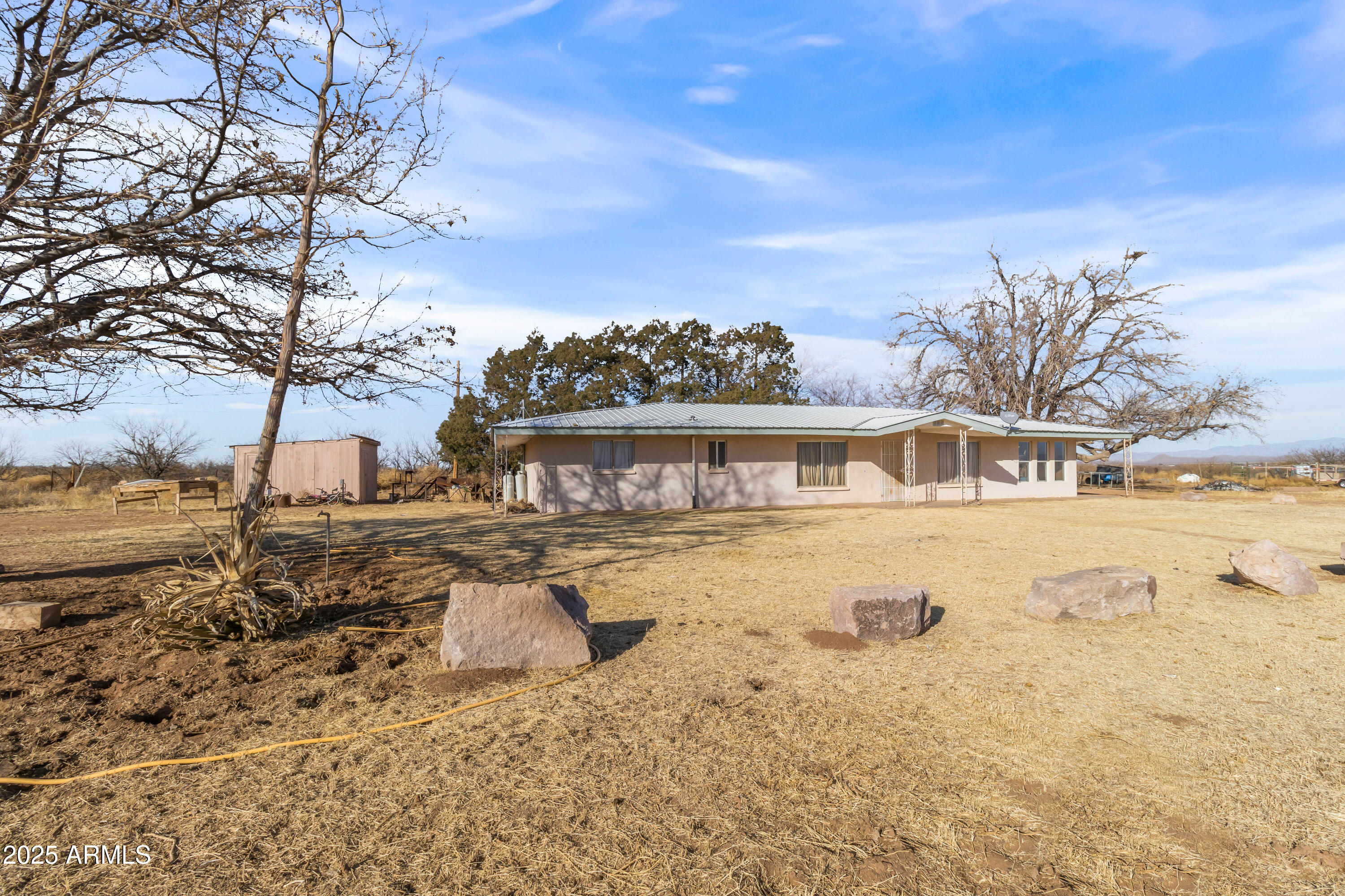 4842 West Gleeson Road Elfrida, AZ 85610 - Photo 13 of 51 a view of a house with snow on the road