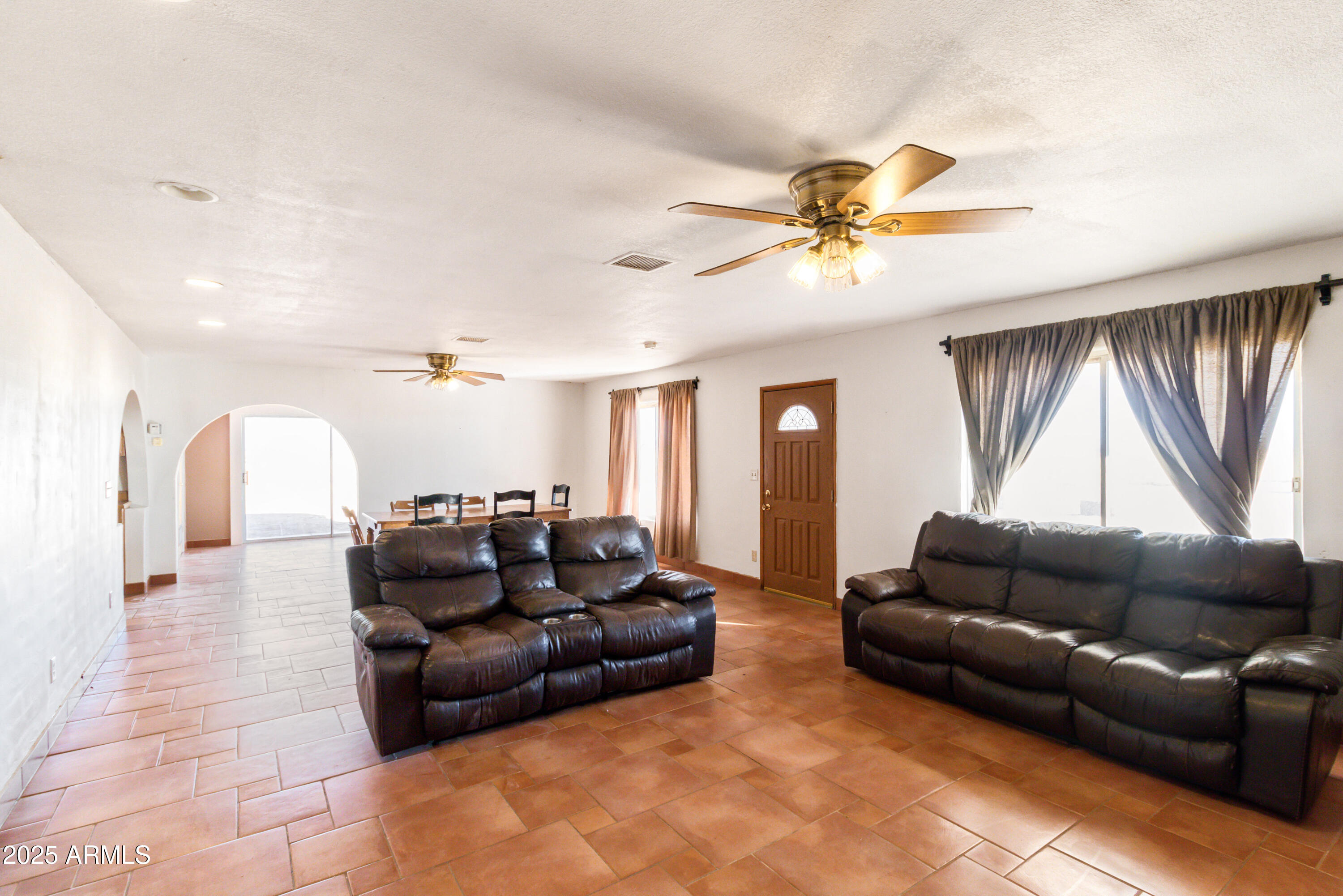4842 West Gleeson Road Elfrida, AZ 85610 - Photo 20 of 51 a living room with furniture and a window