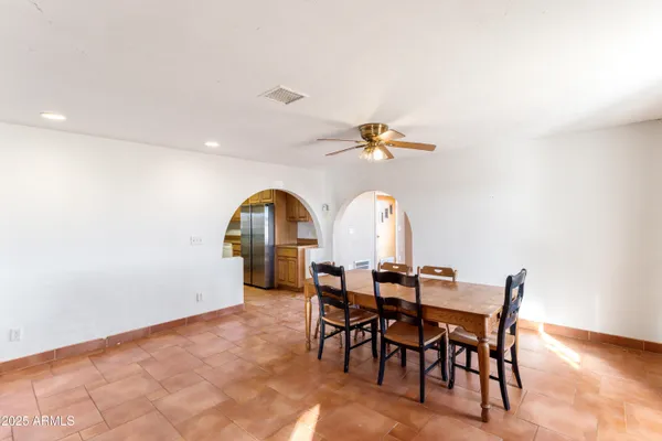 a kitchen that has a sink and a stove in it