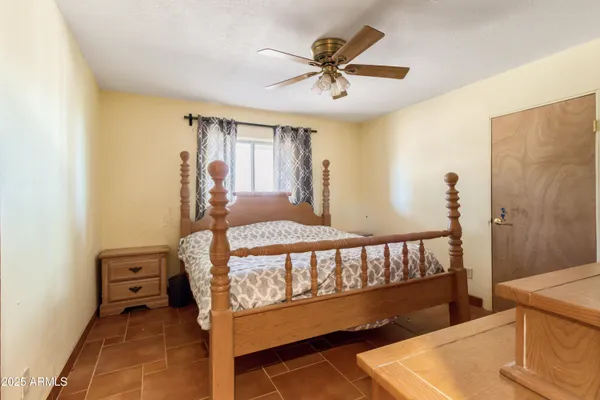 a bed room with a bed and a window