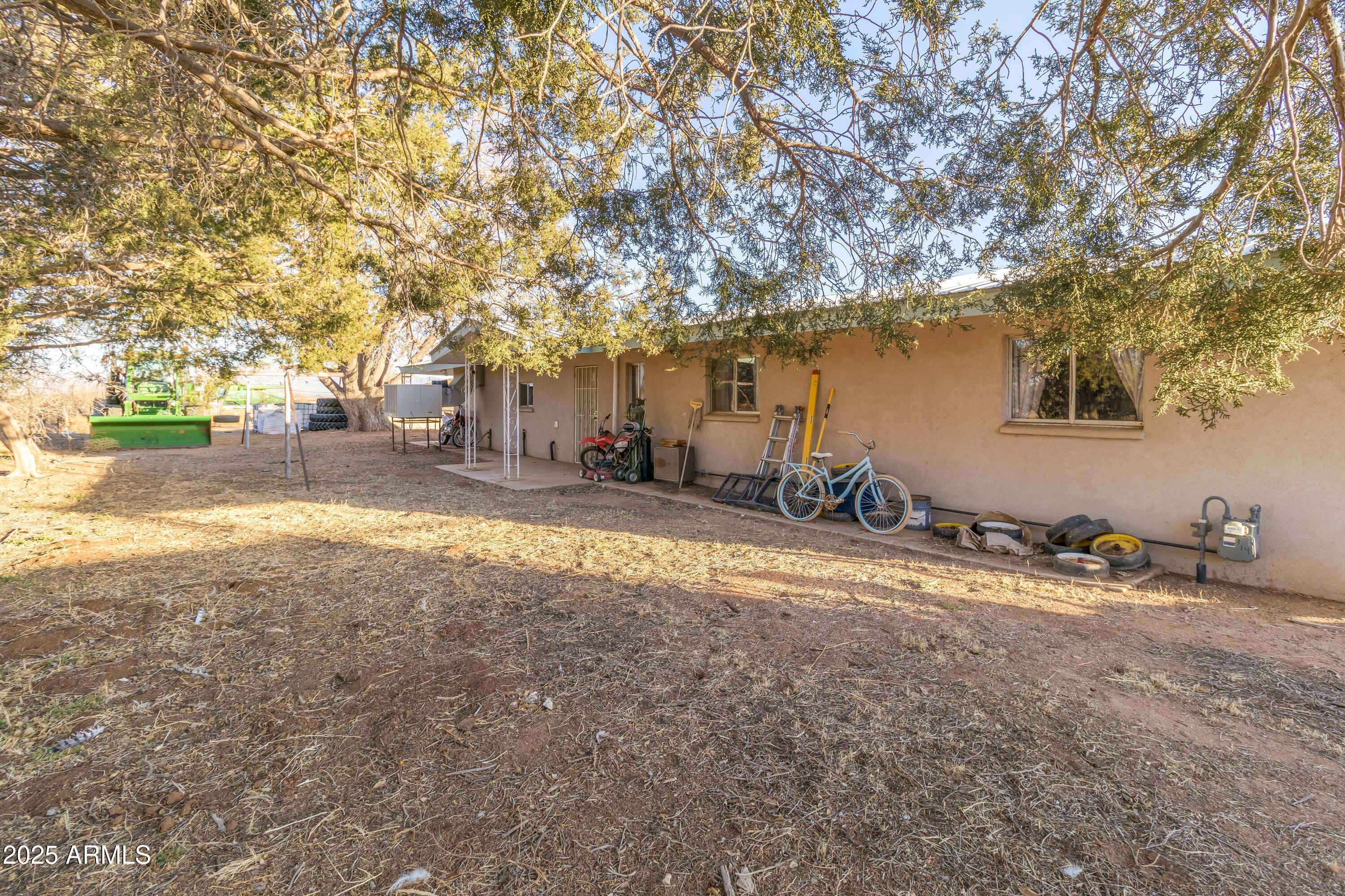 4842 West Gleeson Road Elfrida, AZ 85610 - Photo 46 of 51 a backyard of a house with table and chairs