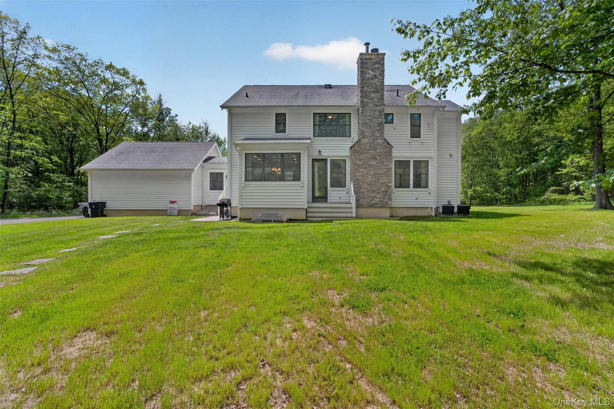 28 Bethlehem Road New Windsor, NY 12553 - Photo 46 of 50 a front view of house with yard and trees all around