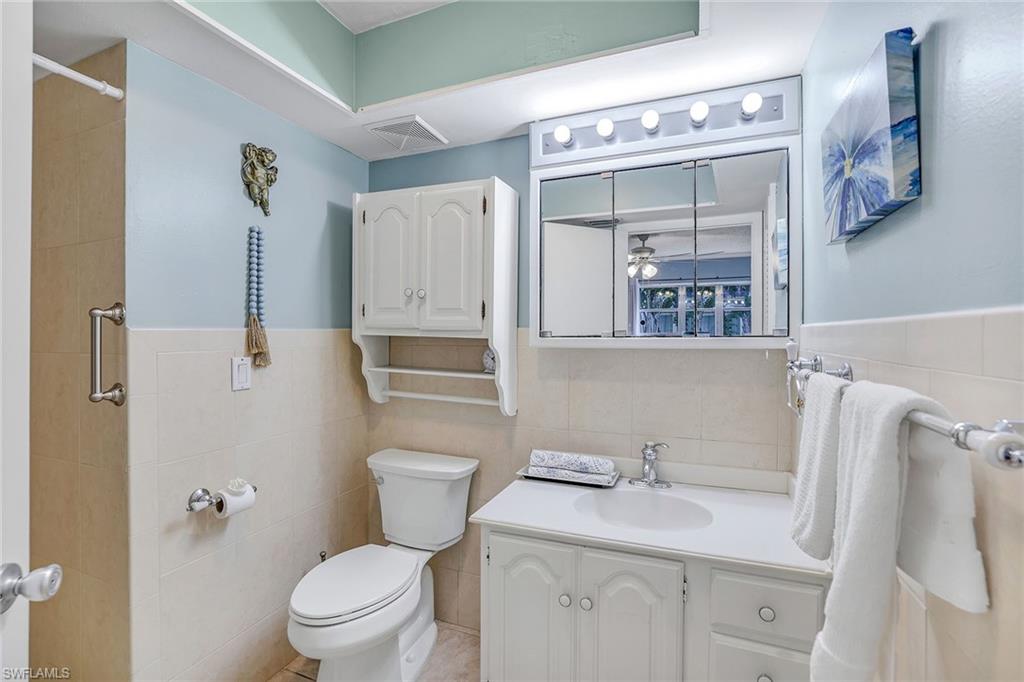 12 Watercolor Way, Unit 12 Naples, FL 34113 - Photo 23 of 35 a bathroom with a sink toilet and shower