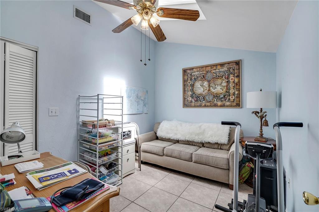 12 Watercolor Way, Unit 12 Naples, FL 34113 - Photo 27 of 35 a living room with furniture and a window