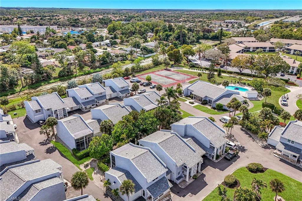 12 Watercolor Way, Unit 12 Naples, FL 34113 - Photo 33 of 35 an aerial view of residential houses with outdoor space
