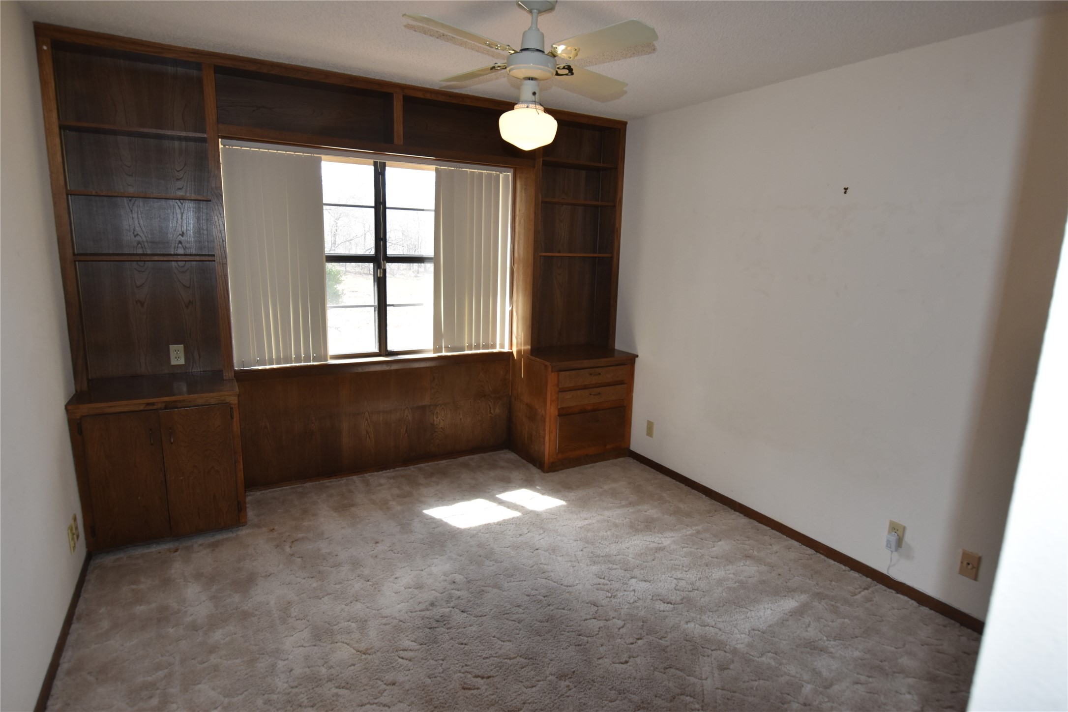 687 Fm 812 Road Red Rock, TX 78662 - Photo 32 of 40 Unfurnished room with ceiling fan and carpet floors