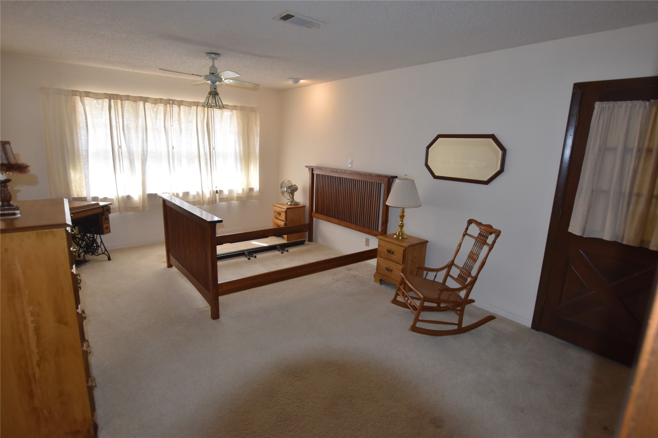 687 Fm 812 Road Red Rock, TX 78662 - Photo 33 of 40 Carpeted bedroom featuring ceiling fan