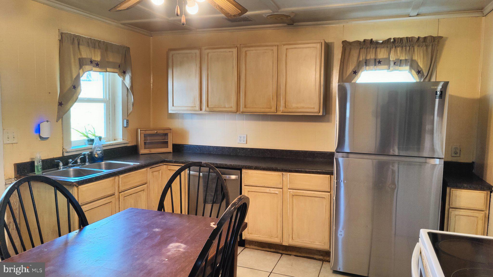 274 West Railroad Street Reedsville, PA 17084 - Photo 7 of 32 a kitchen with stainless steel appliances granite countertop a refrigerator a sink and white cabinets
