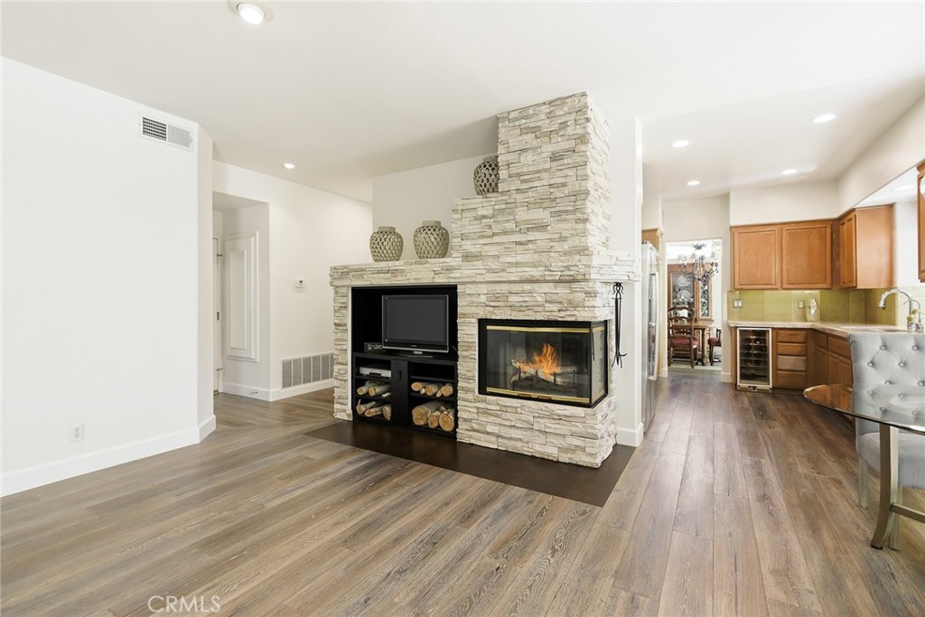 4762 Rhapsody Drive Oak Park, CA 91377 - Photo 13 of 29 a living room with furniture and a fireplace