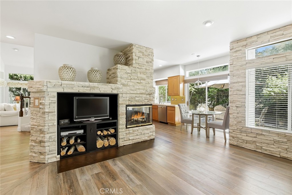 4762 Rhapsody Drive Oak Park, CA 91377 - Photo 15 of 29 a living room with furniture and a fireplace