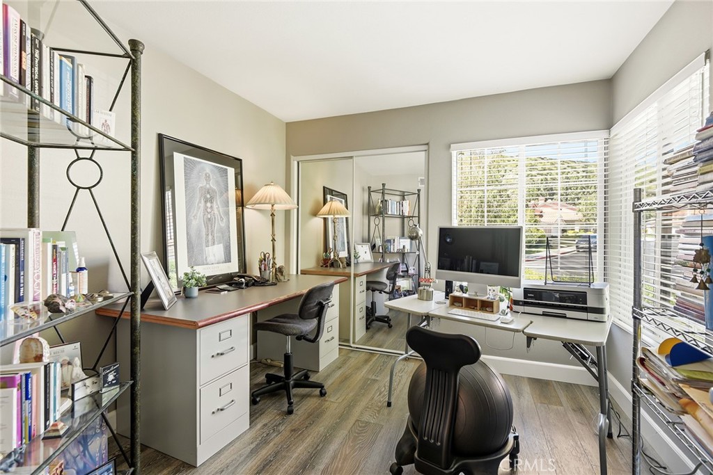 4762 Rhapsody Drive Oak Park, CA 91377 - Photo 16 of 29 a view of a workspace with furniture and a window