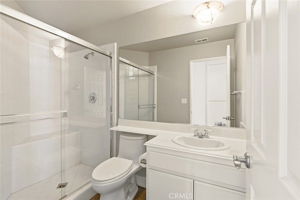 4762 Rhapsody Drive Oak Park, CA 91377 - Photo 17 of 29 a bathroom with a sink toilet and shower