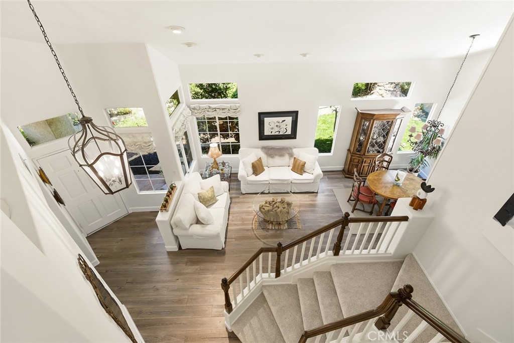 4762 Rhapsody Drive Oak Park, CA 91377 - Photo 19 of 29 a living room with furniture and wooden floor
