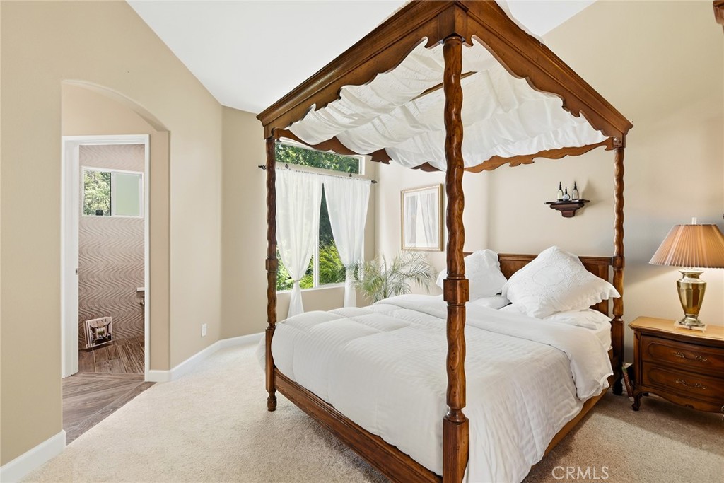 4762 Rhapsody Drive Oak Park, CA 91377 - Photo 20 of 29 a bedroom with a bed and a large window