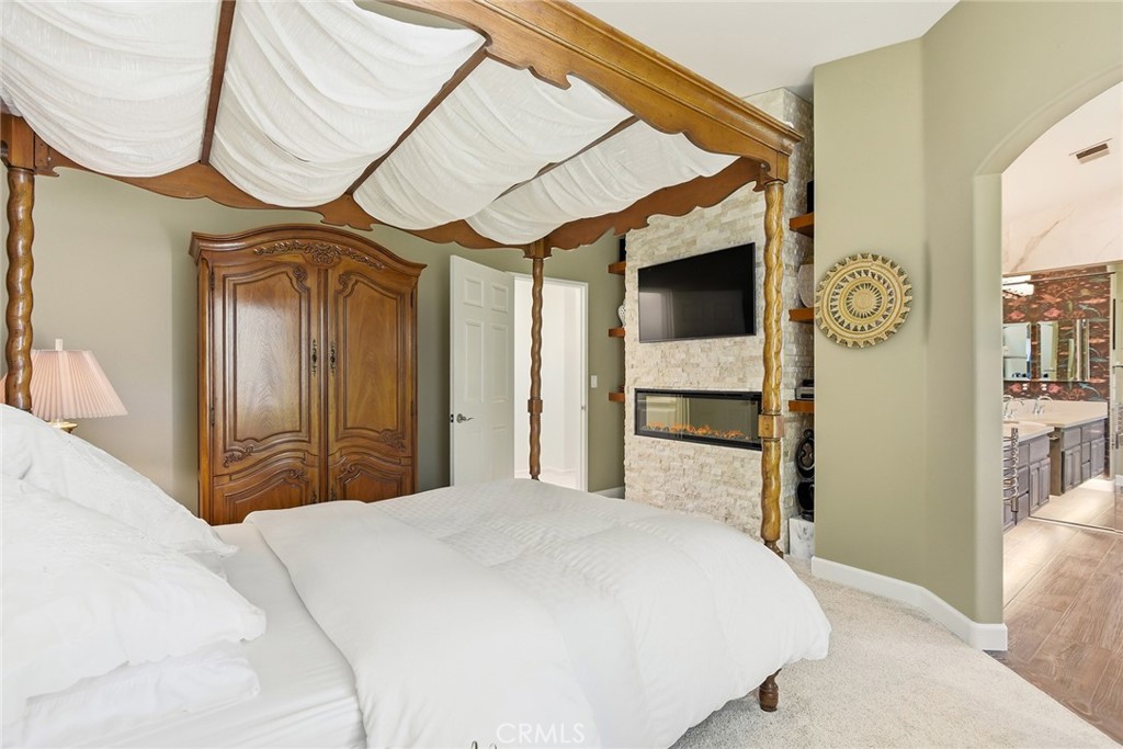 4762 Rhapsody Drive Oak Park, CA 91377 - Photo 21 of 29 a bedroom with a bed and a mirror