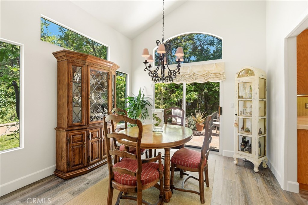 4762 Rhapsody Drive Oak Park, CA 91377 - Photo 7 of 29 a view of a dining room with furniture window and wooden floor