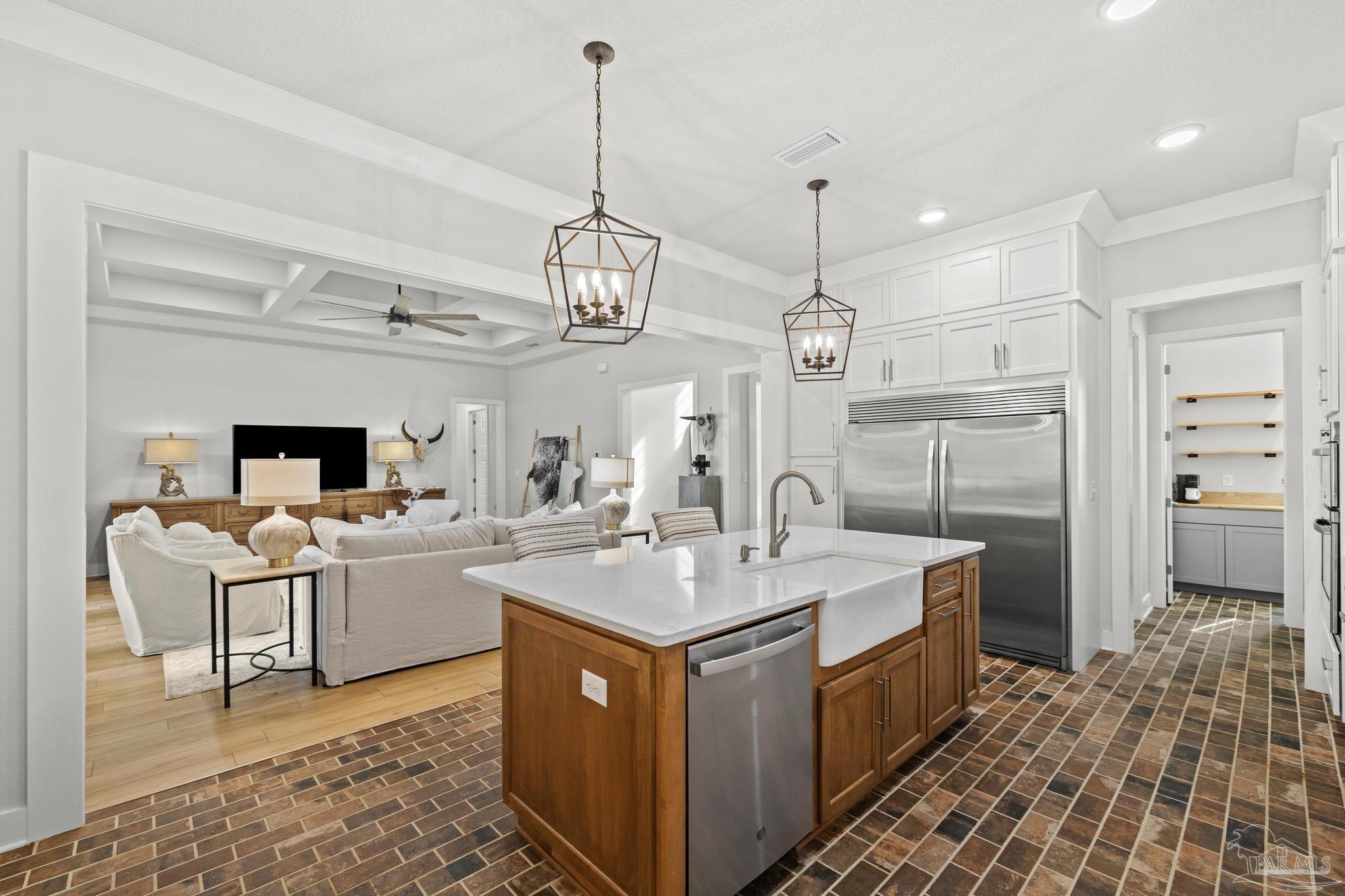 2031 Rambling Oaks Drive Cantonment, FL 32533 - Photo 15 of 62 a kitchen that has a lot of cabinets in it