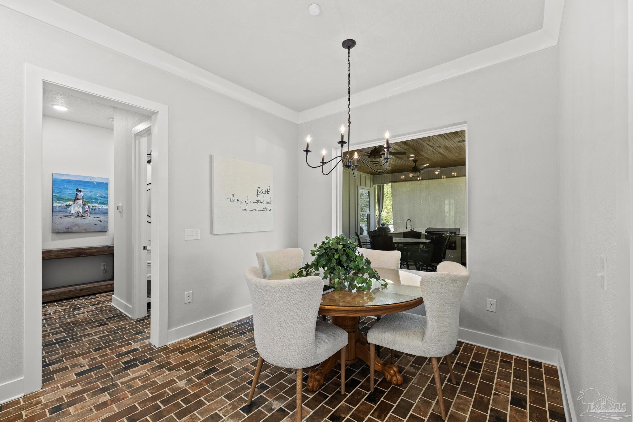 2031 Rambling Oaks Drive Cantonment, FL 32533 - Photo 18 of 62 a view of a dining room with furniture