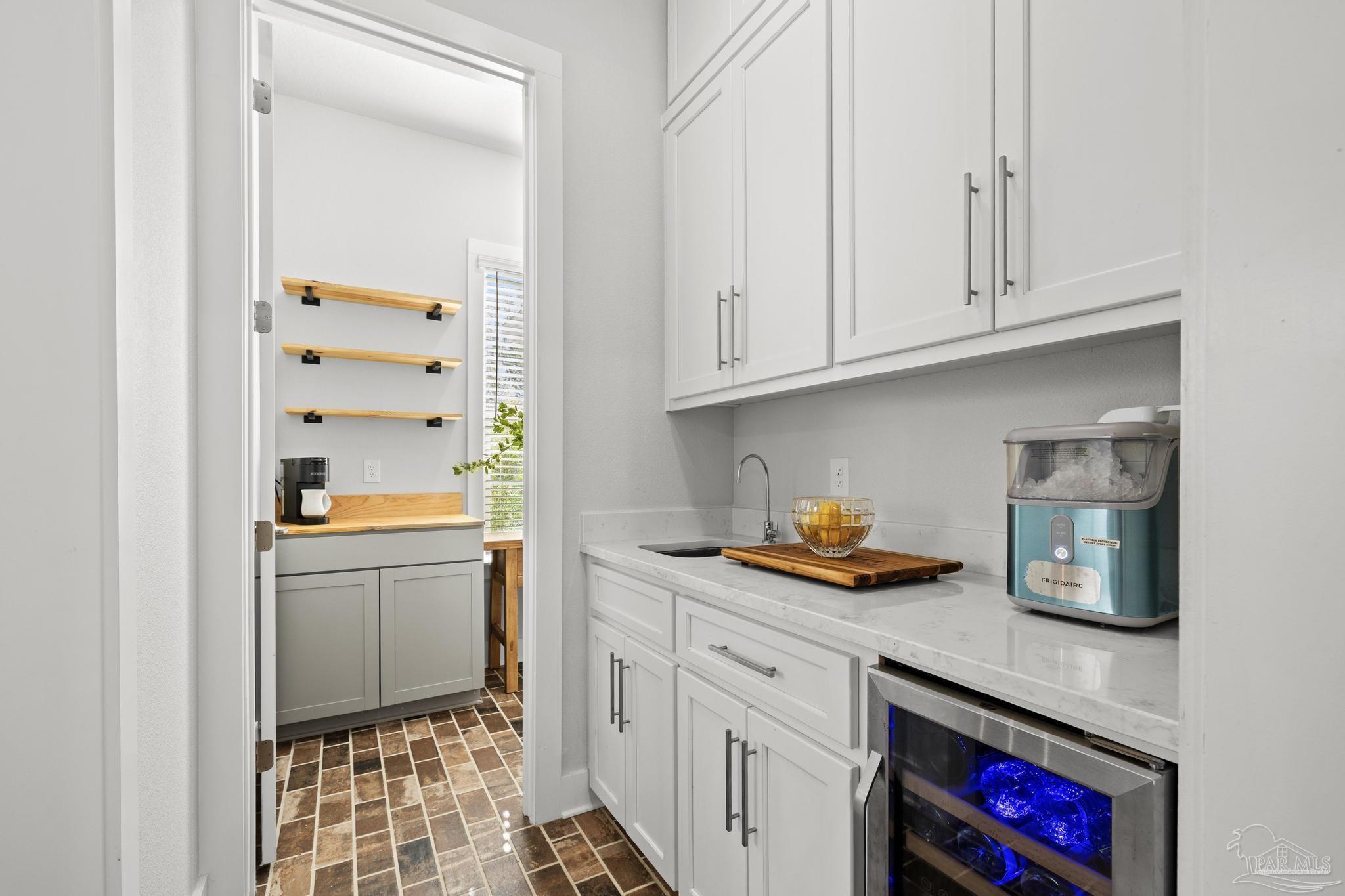 2031 Rambling Oaks Drive Cantonment, FL 32533 - Photo 23 of 62 a kitchen with stainless steel appliances granite countertop a sink and cabinets