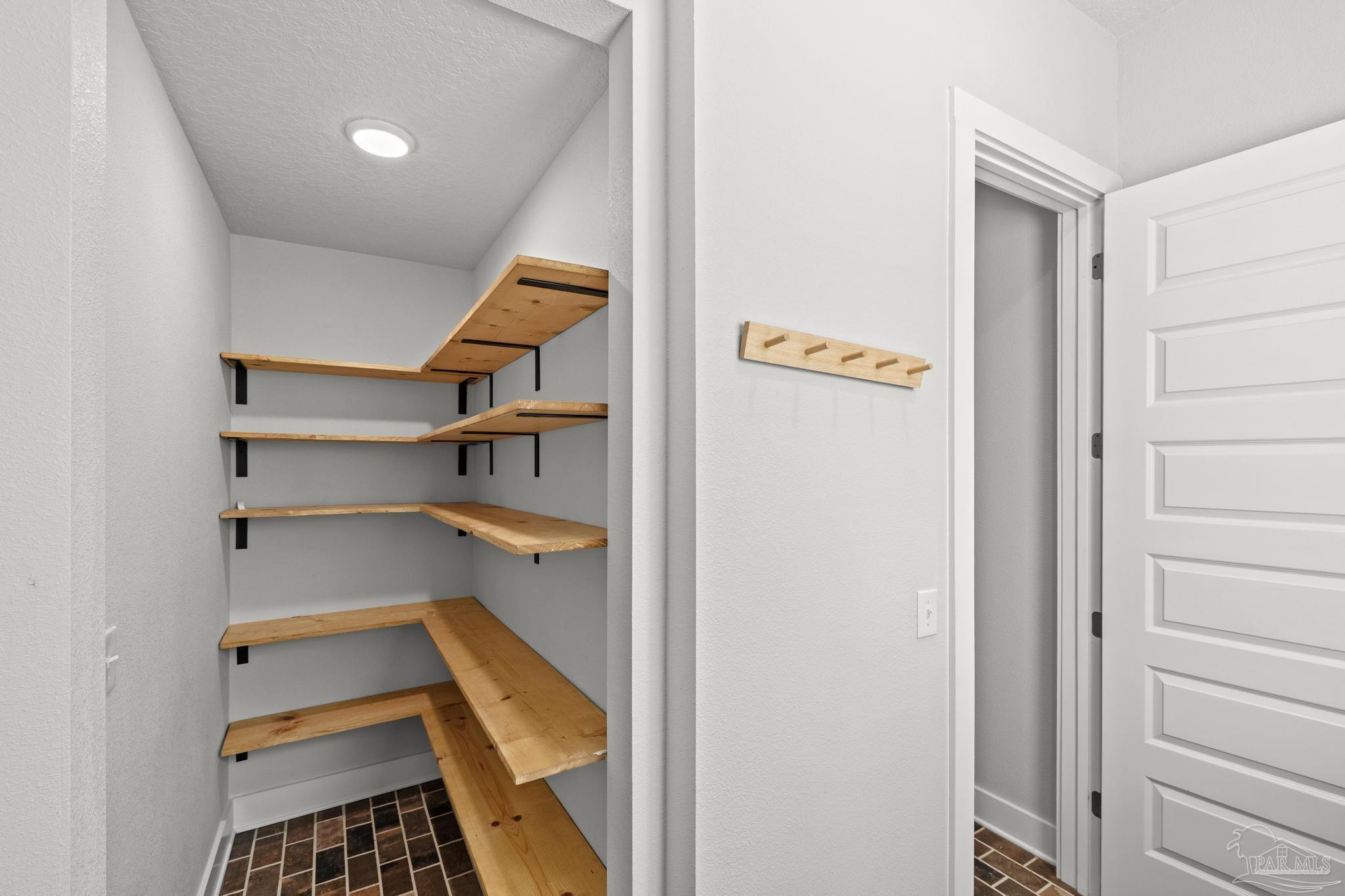 2031 Rambling Oaks Drive Cantonment, FL 32533 - Photo 26 of 62 a room with storage and utility