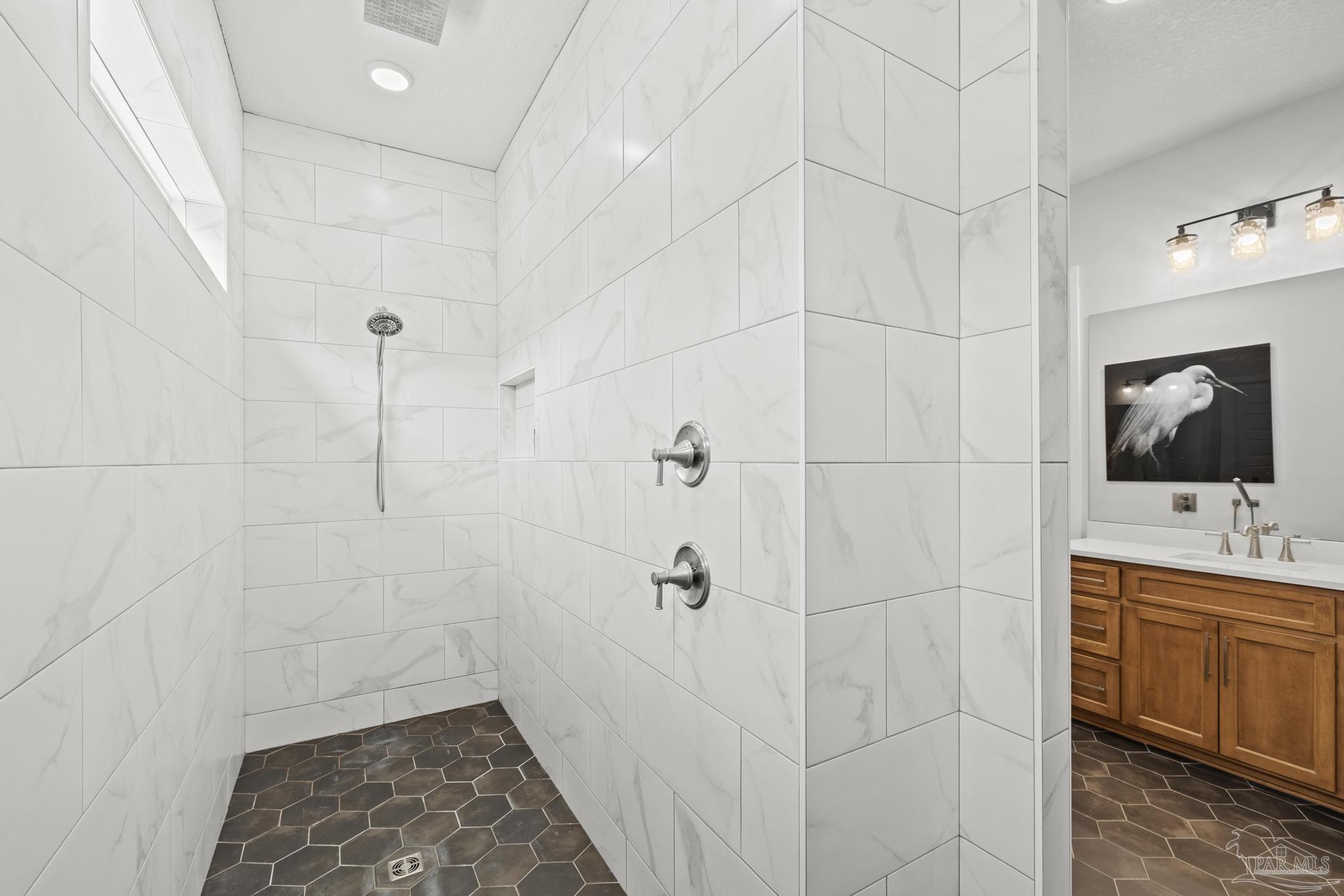 2031 Rambling Oaks Drive Cantonment, FL 32533 - Photo 34 of 62 a bathroom with a bathtub and a sink