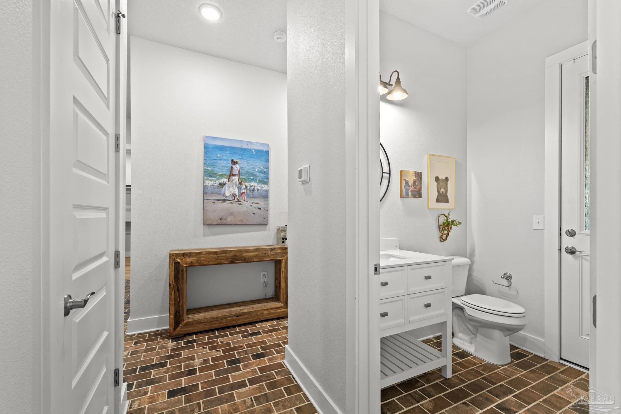 2031 Rambling Oaks Drive Cantonment, FL 32533 - Photo 48 of 62 a bathroom with a toilet a shower and a sink