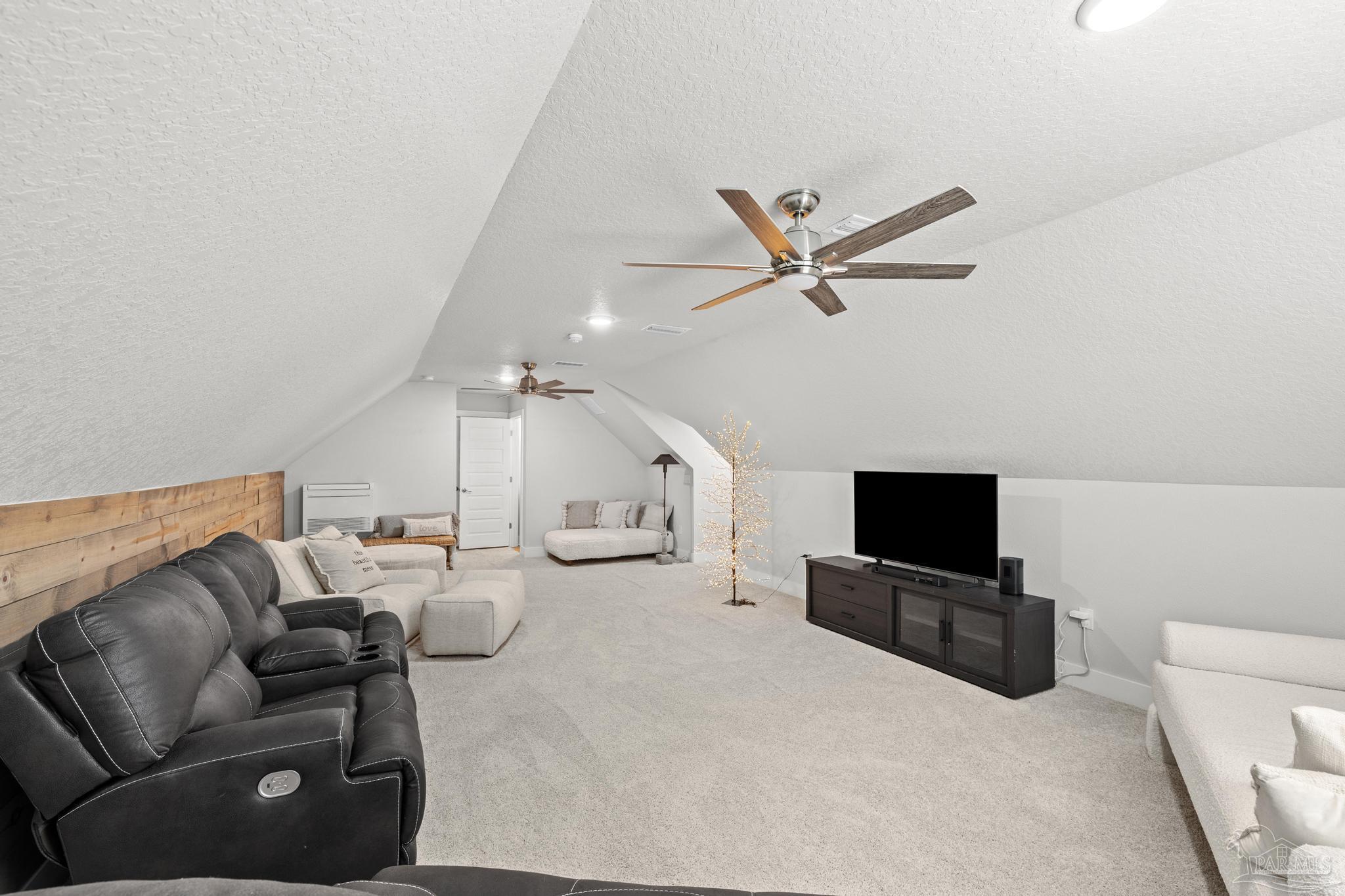 2031 Rambling Oaks Drive Cantonment, FL 32533 - Photo 52 of 62 a living room with furniture and a flat screen tv