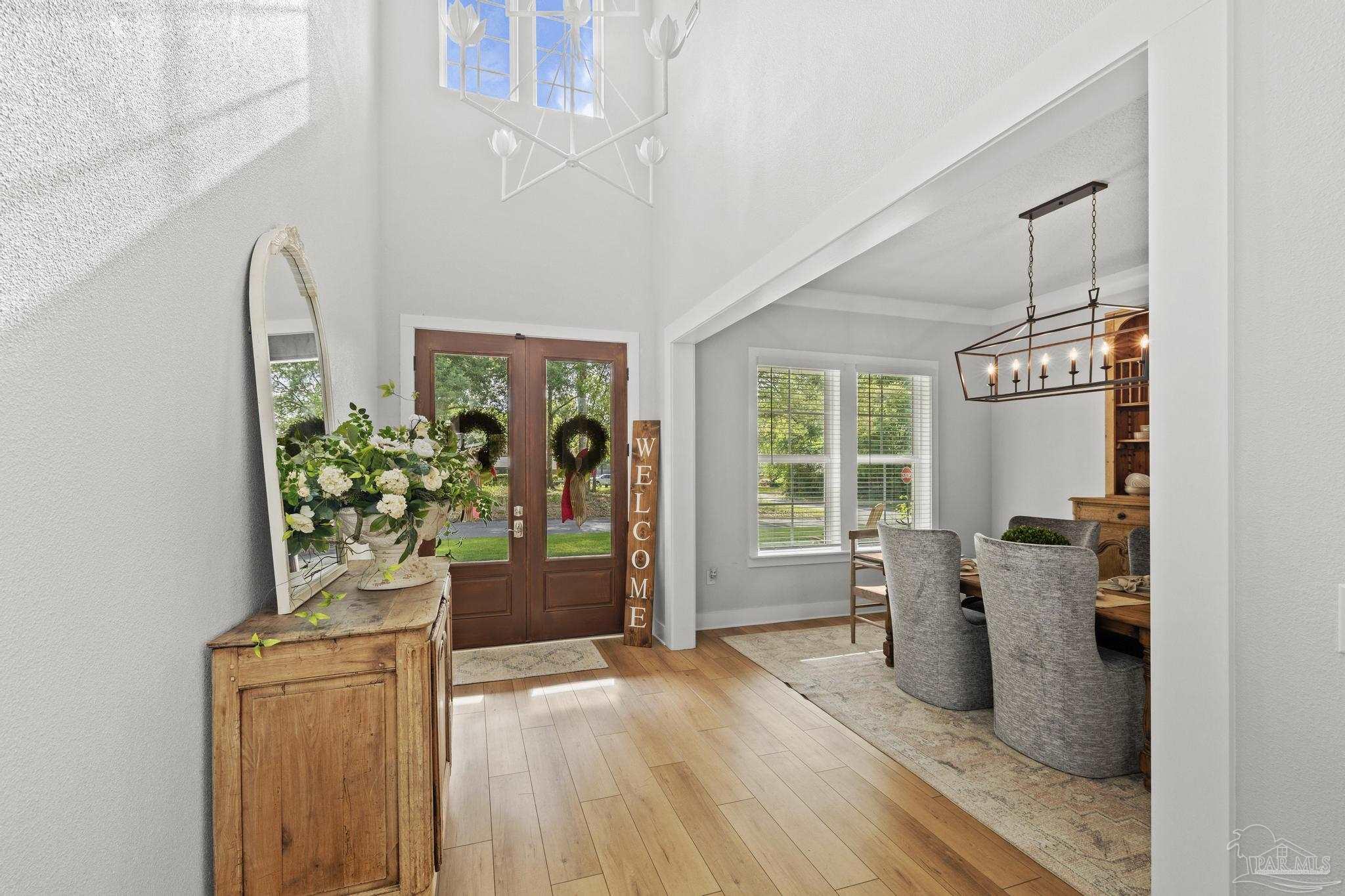 2031 Rambling Oaks Drive Cantonment, FL 32533 - Photo 6 of 62 a view of a room with wooden floor and windows