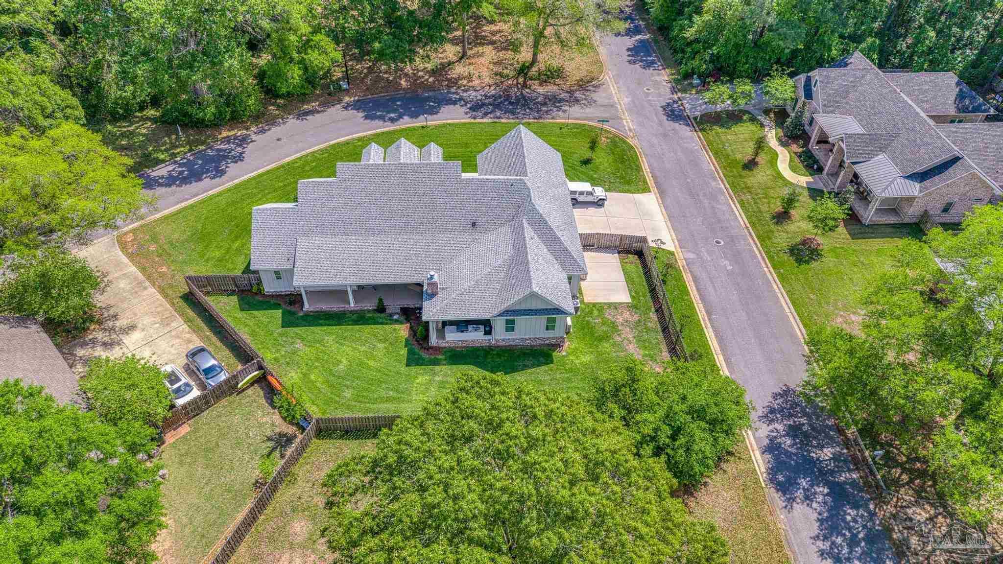 2031 Rambling Oaks Drive Cantonment, FL 32533 - Photo 61 of 62 an aerial view of residential house with outdoor space and swimming pool