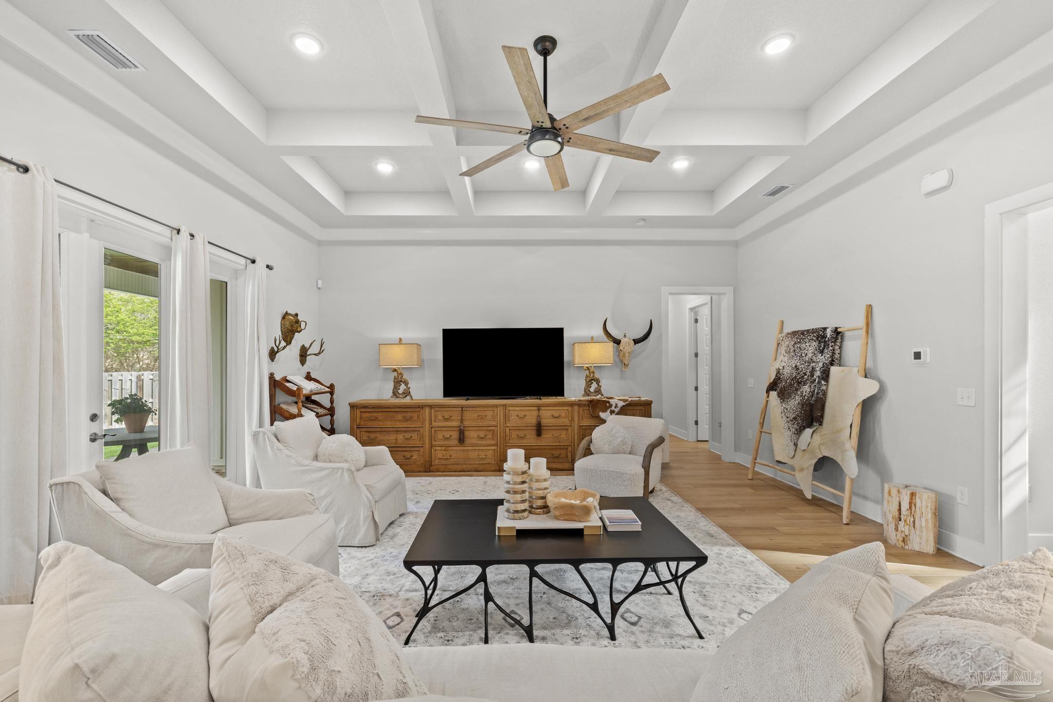 2031 Rambling Oaks Drive Cantonment, FL 32533 - Photo 10 of 62 a living room with furniture and a flat screen tv