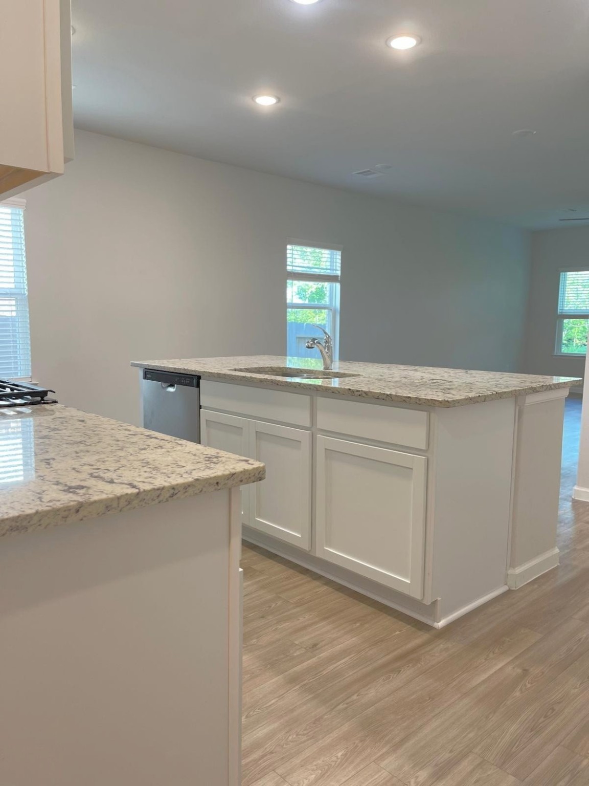 52 Valiant Ridge Trail Magnolia, TX 77354 - Photo 11 of 16 a kitchen with granite countertop cabinets stainless steel appliances and a sink