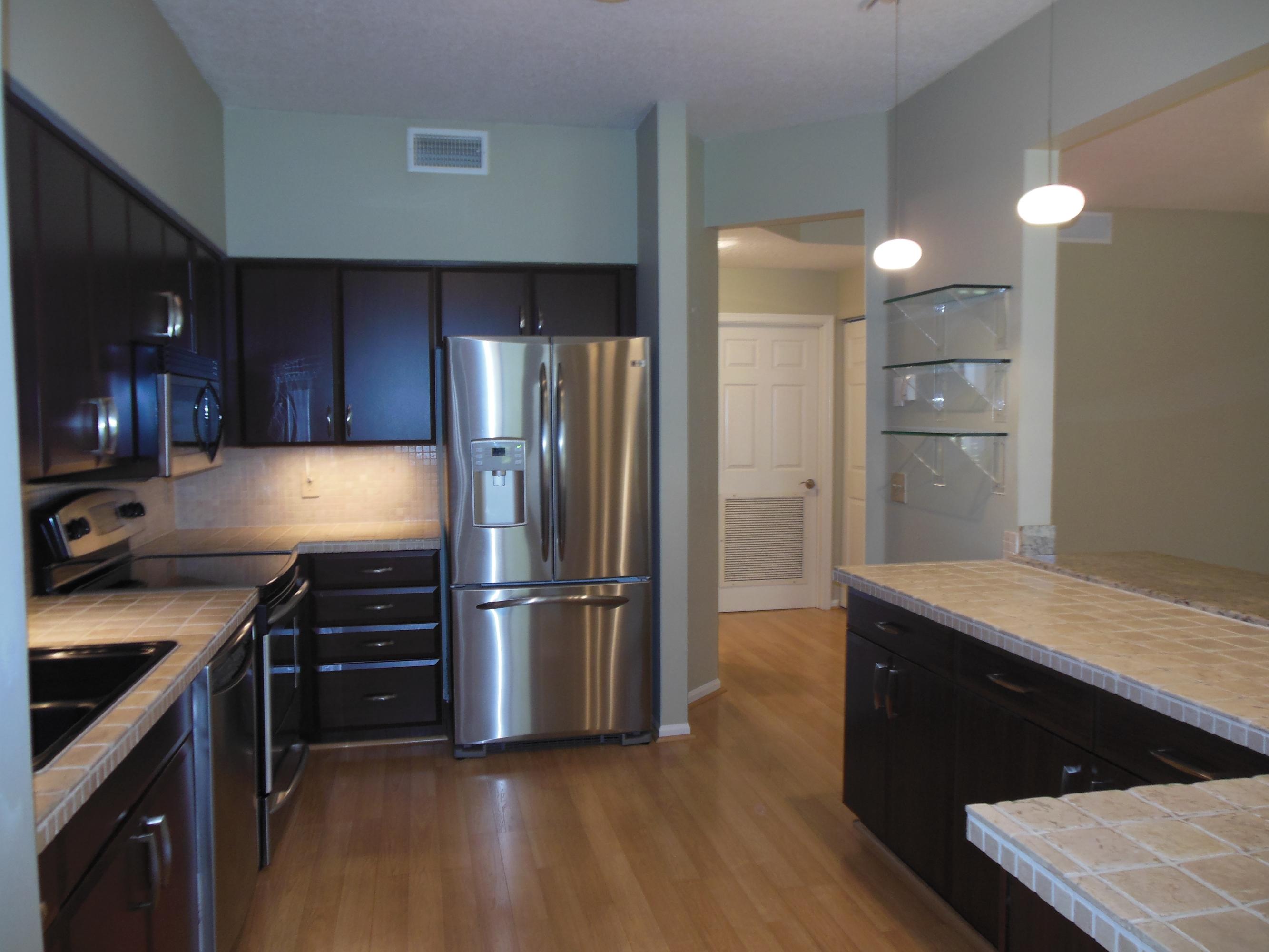 5780 Coach House Circle, Unit A Boca Raton, FL 33486 - Photo 3 of 37 Kitchen w/stainless steel appliances