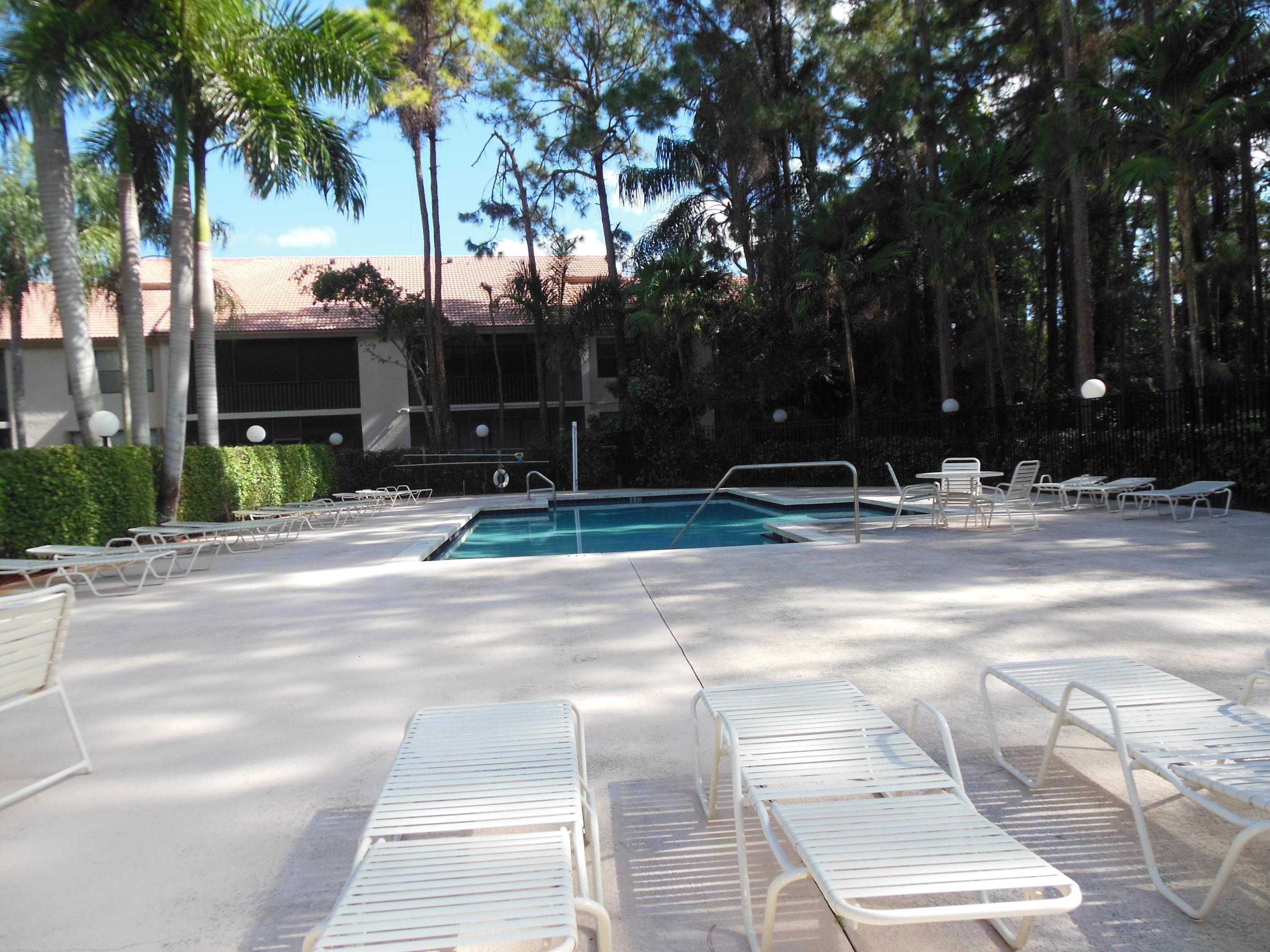 5780 Coach House Circle, Unit A Boca Raton, FL 33486 - Photo 34 of 37 Community Pool Around Your Back Door