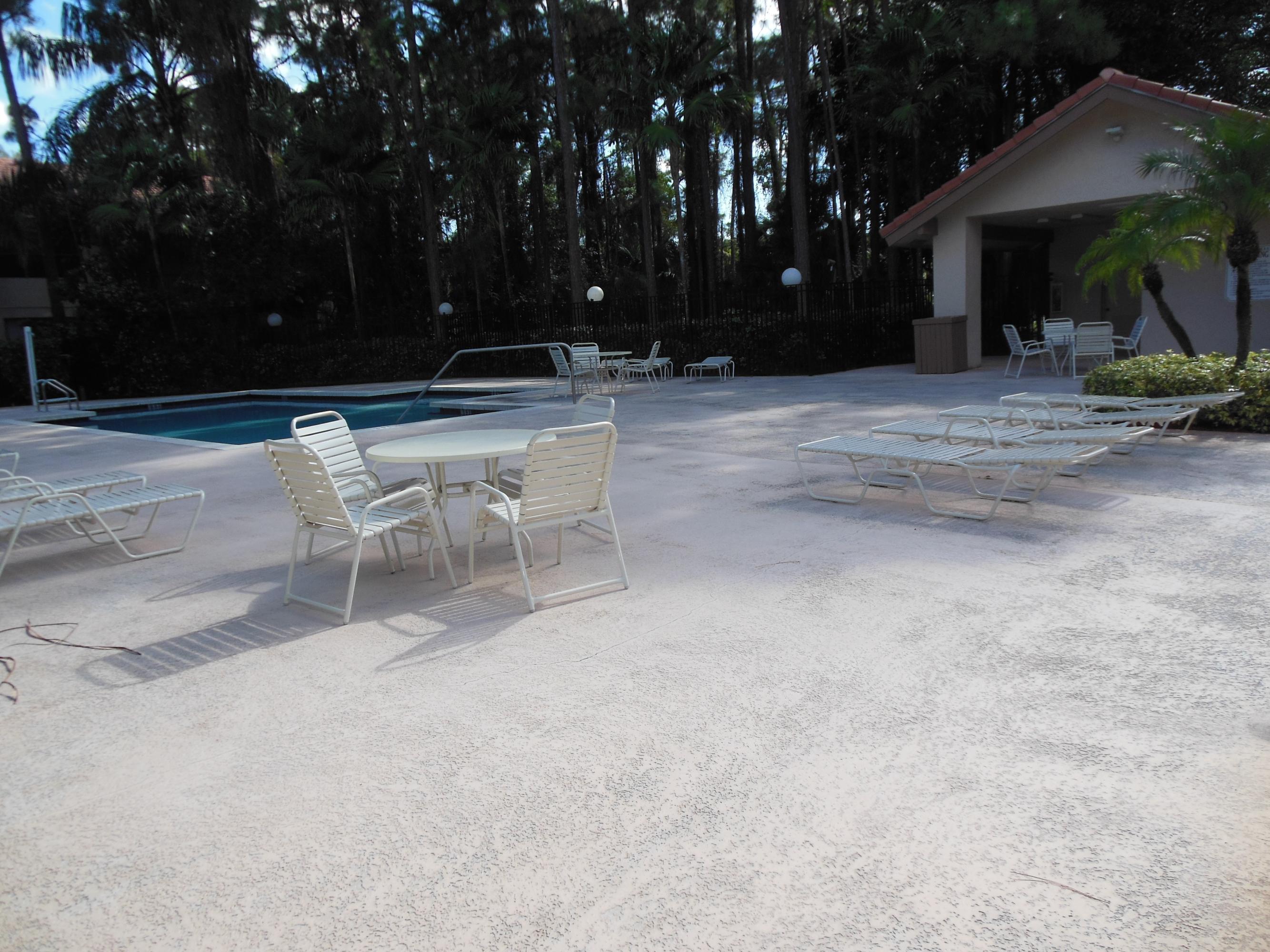 5780 Coach House Circle, Unit A Boca Raton, FL 33486 - Photo 35 of 37 Community Pool Deck & Bathrooms