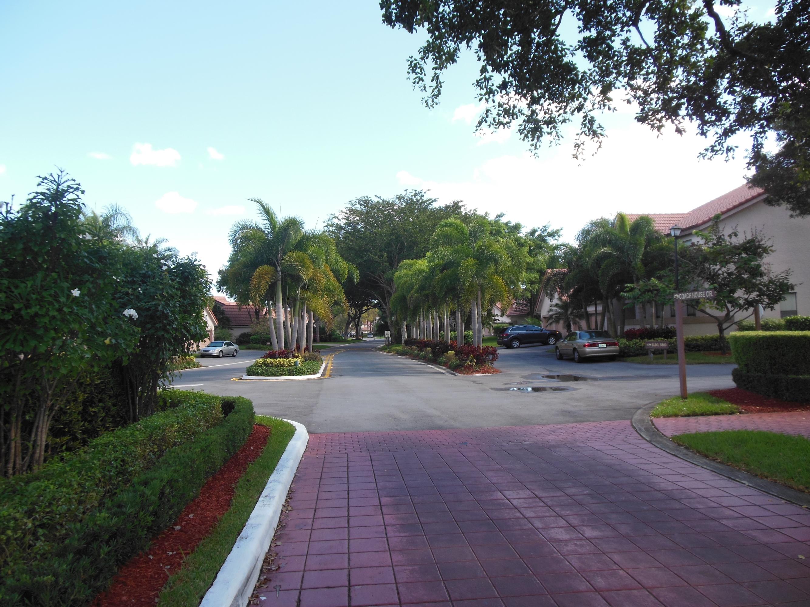 5780 Coach House Circle, Unit A Boca Raton, FL 33486 - Photo 36 of 37 Street View into Coach Houses