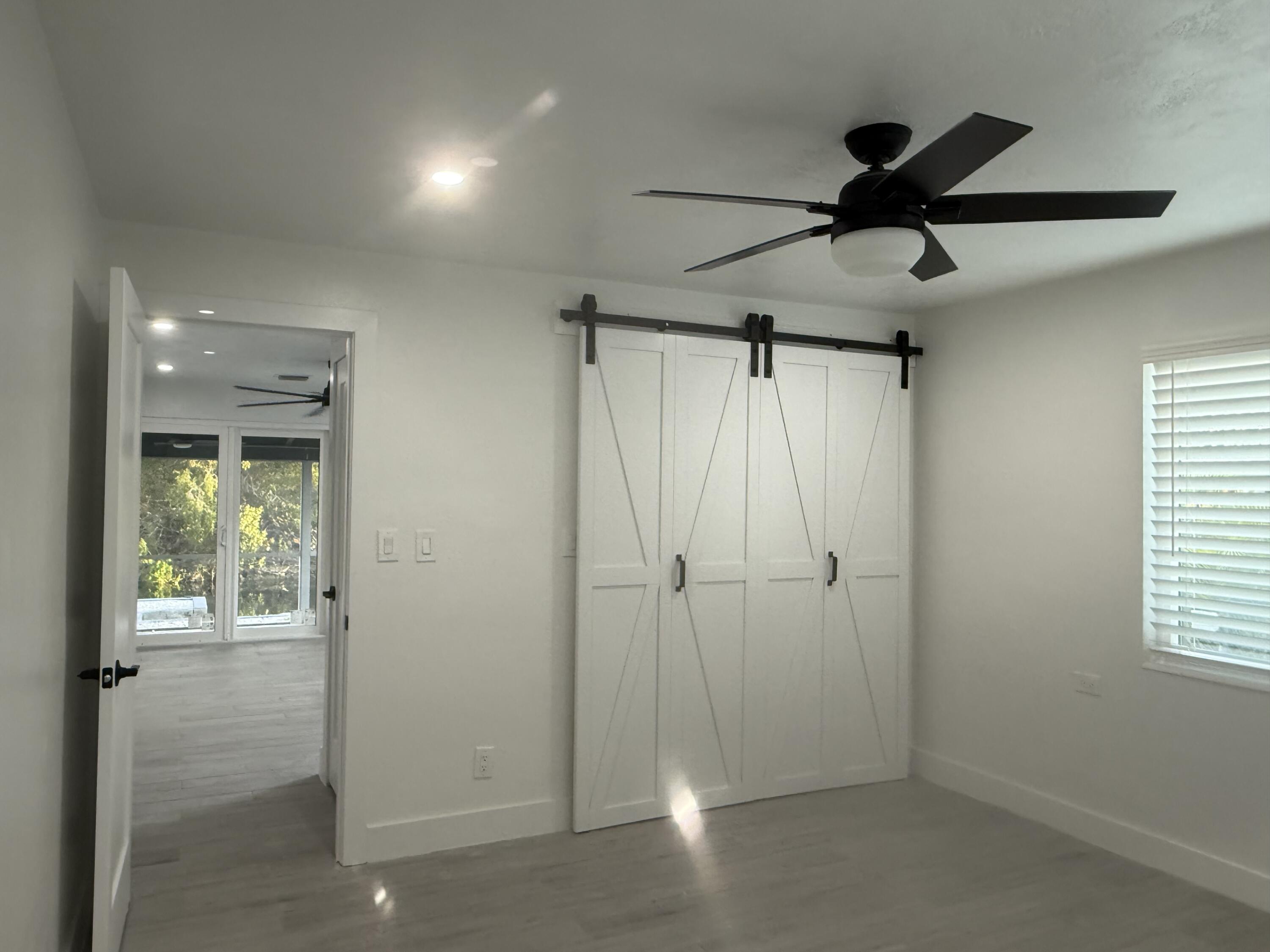 29656 Constitution Avenue Big Pine Key, FL 33043 - Photo 11 of 15 a view of hallway with window and a ceiling fan