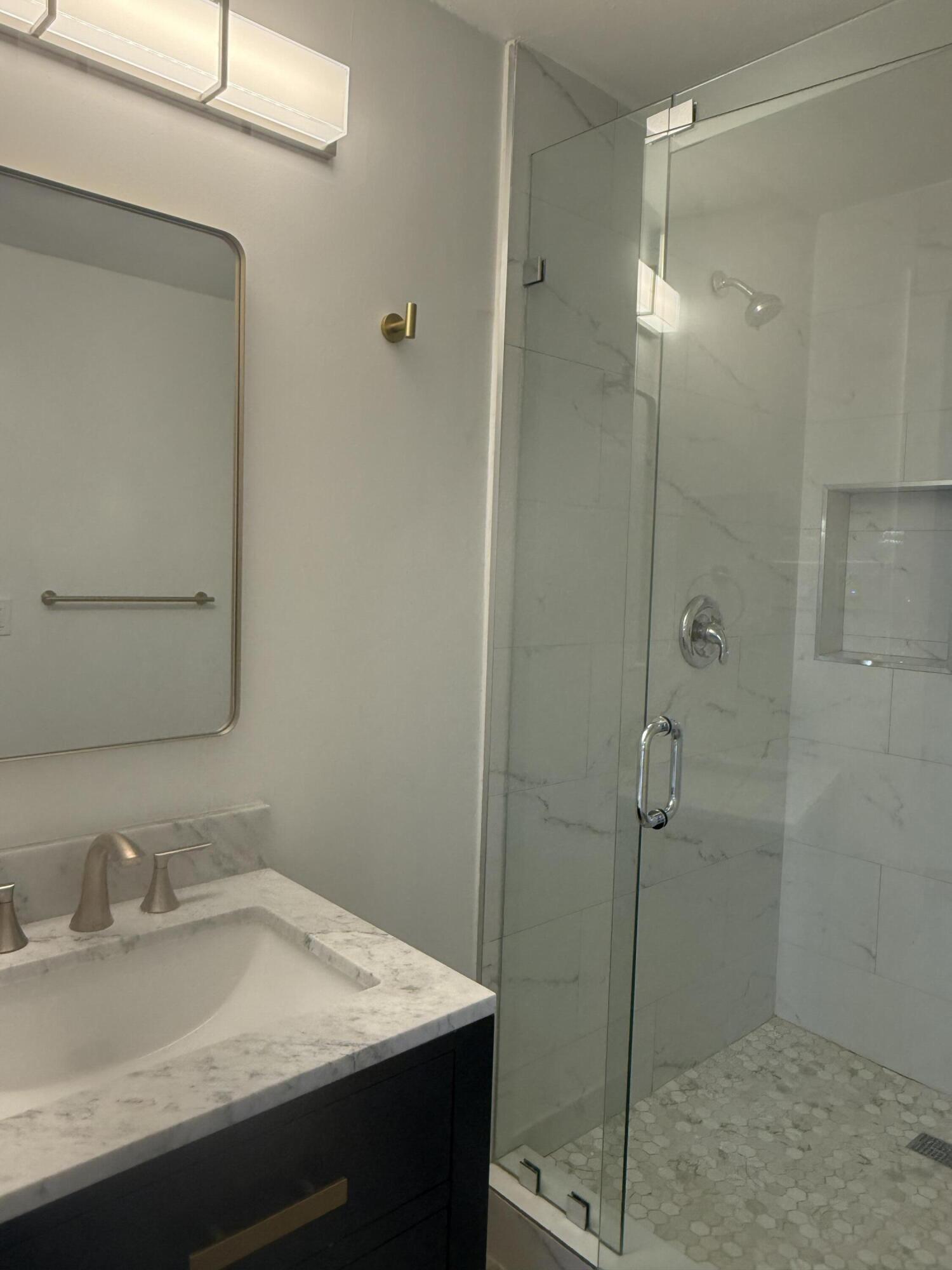 29656 Constitution Avenue Big Pine Key, FL 33043 - Photo 13 of 15 a bathroom with a granite countertop sink mirror and shower