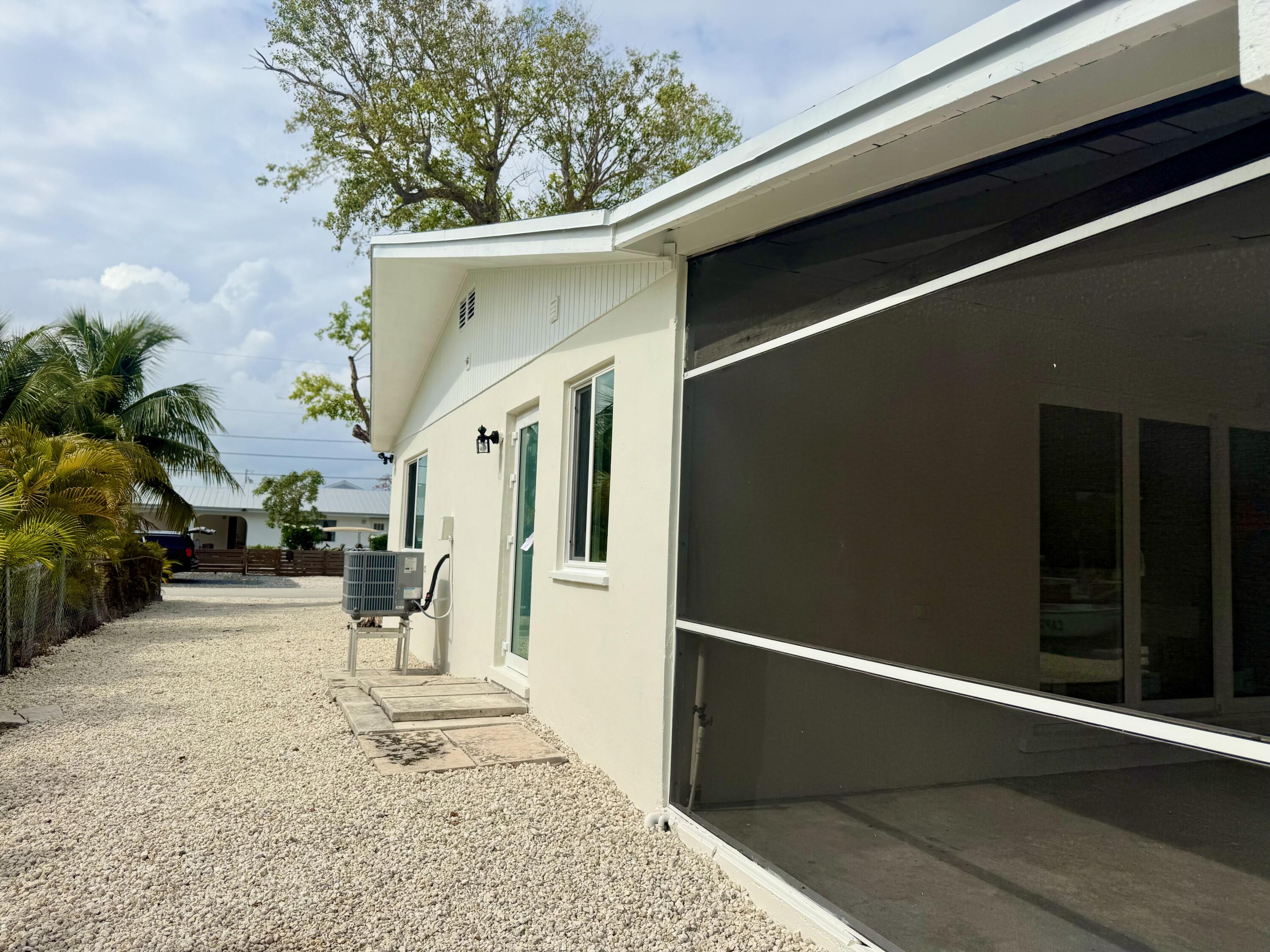 29656 Constitution Avenue Big Pine Key, FL 33043 - Photo 3 of 15 a view of a house with a snow in the background