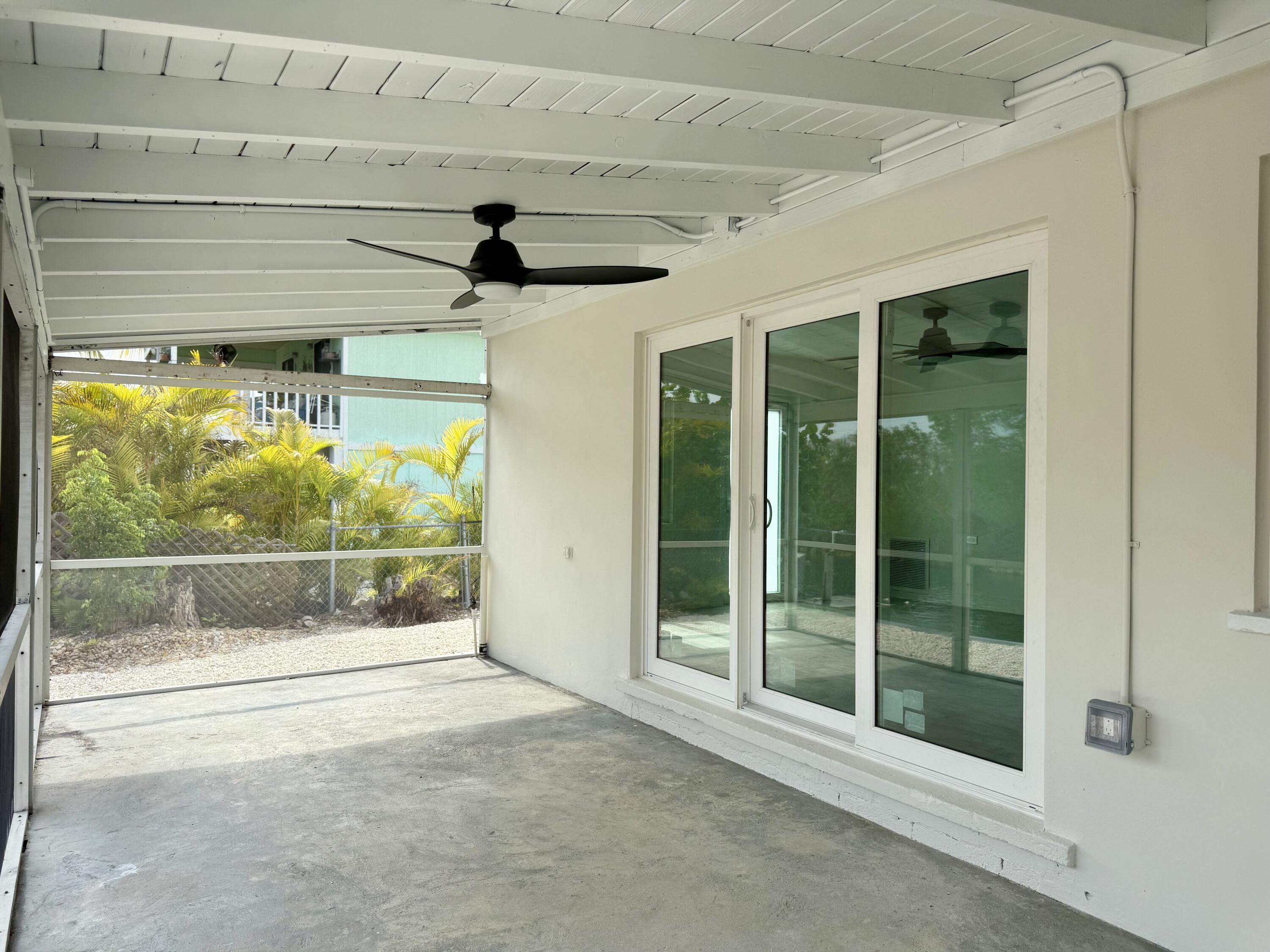 29656 Constitution Avenue Big Pine Key, FL 33043 - Photo 4 of 15 a view of a glass door and window