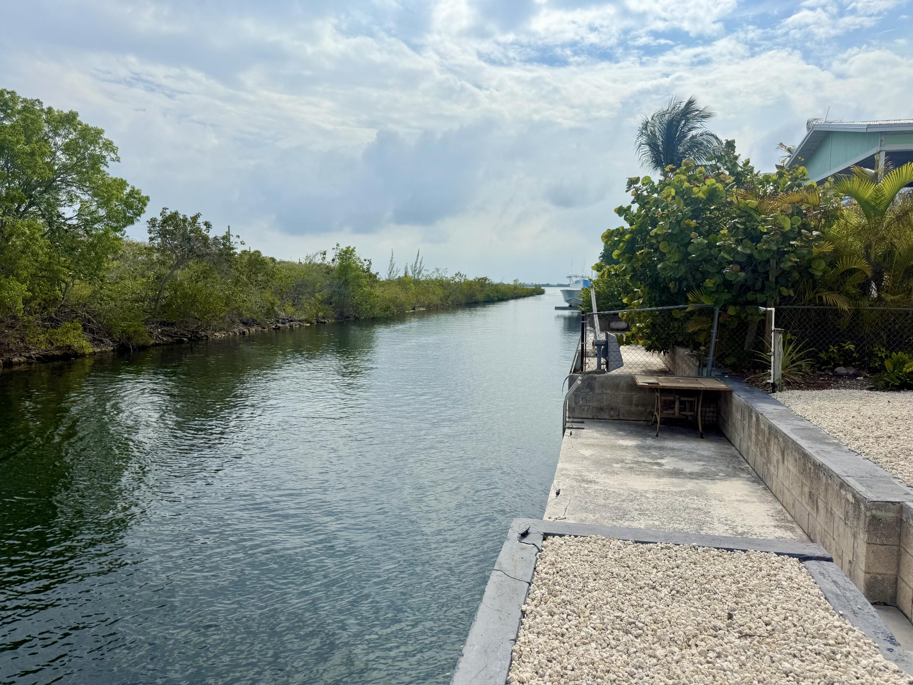 29656 Constitution Avenue Big Pine Key, FL 33043 - Photo 7 of 15 a view of a lake with a patio