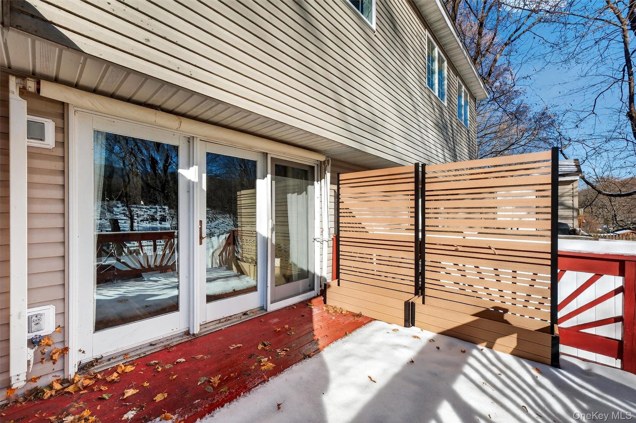 90 Roundtree Court Beacon, NY 12508 - Photo 31 of 39 a view of a patio with table and chairs and wooden fence