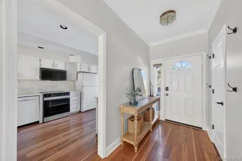 a kitchen with a refrigerator and a stove top oven