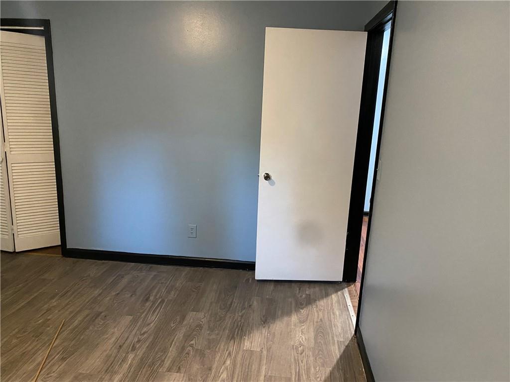 3062 Ferrite Loop Northwest Lawrenceville, GA 30044 - Photo 6 of 10 an empty room with wooden floor