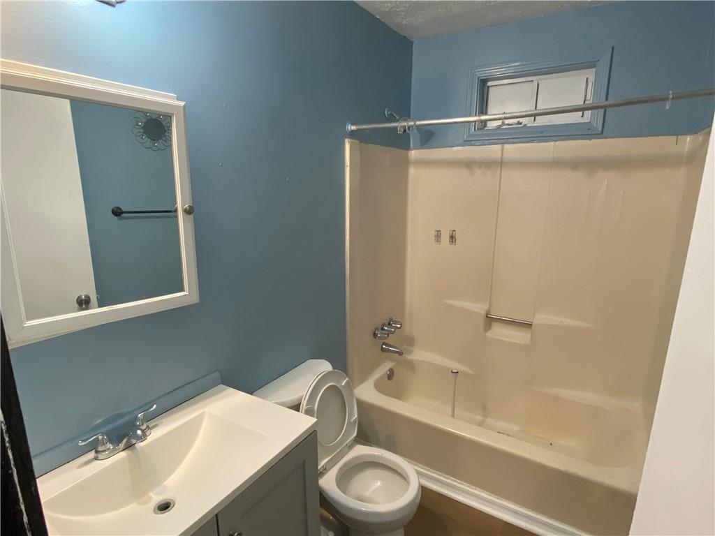3062 Ferrite Loop Northwest Lawrenceville, GA 30044 - Photo 7 of 10 a bathroom with a sink toilet and shower