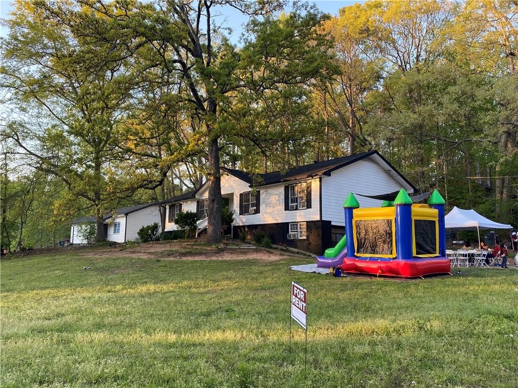 3062 Ferrite Loop Northwest Lawrenceville, GA 30044 - Photo 10 of 10 a front view of house with yard and outdoor seating