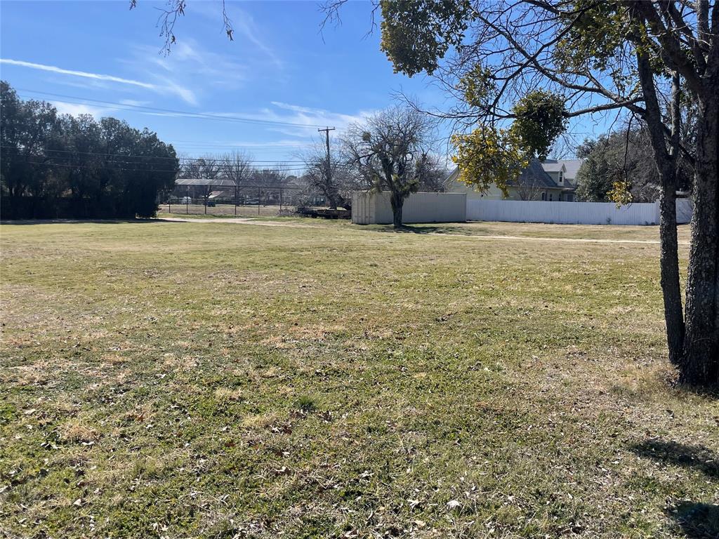 908 4th Street Graham, TX 76450 - Photo 2 of 6 a view of outdoor space with trees