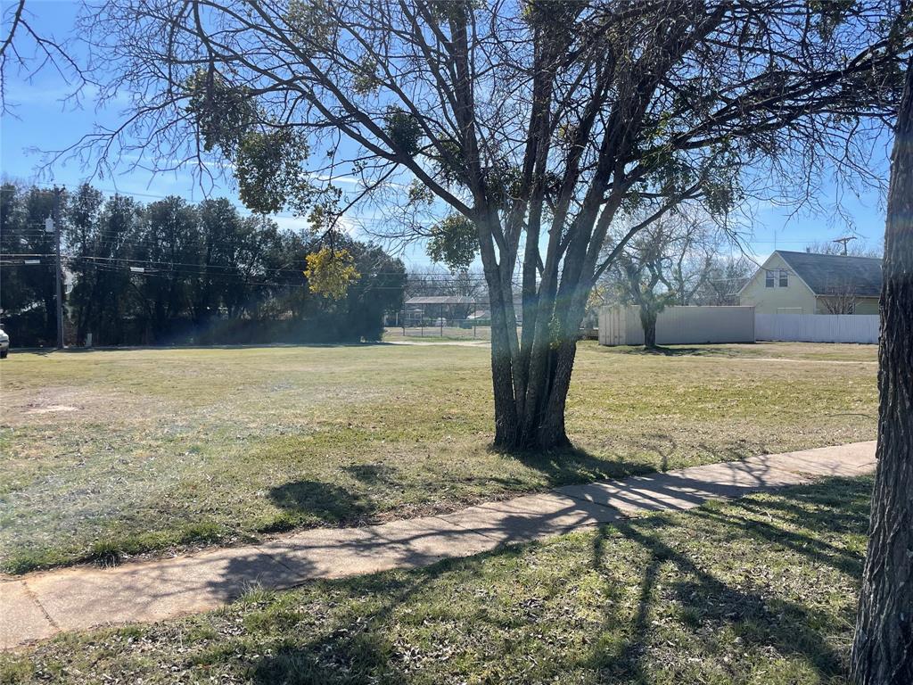 908 4th Street Graham, TX 76450 - Photo 3 of 6 a view of a yard with an outdoor space